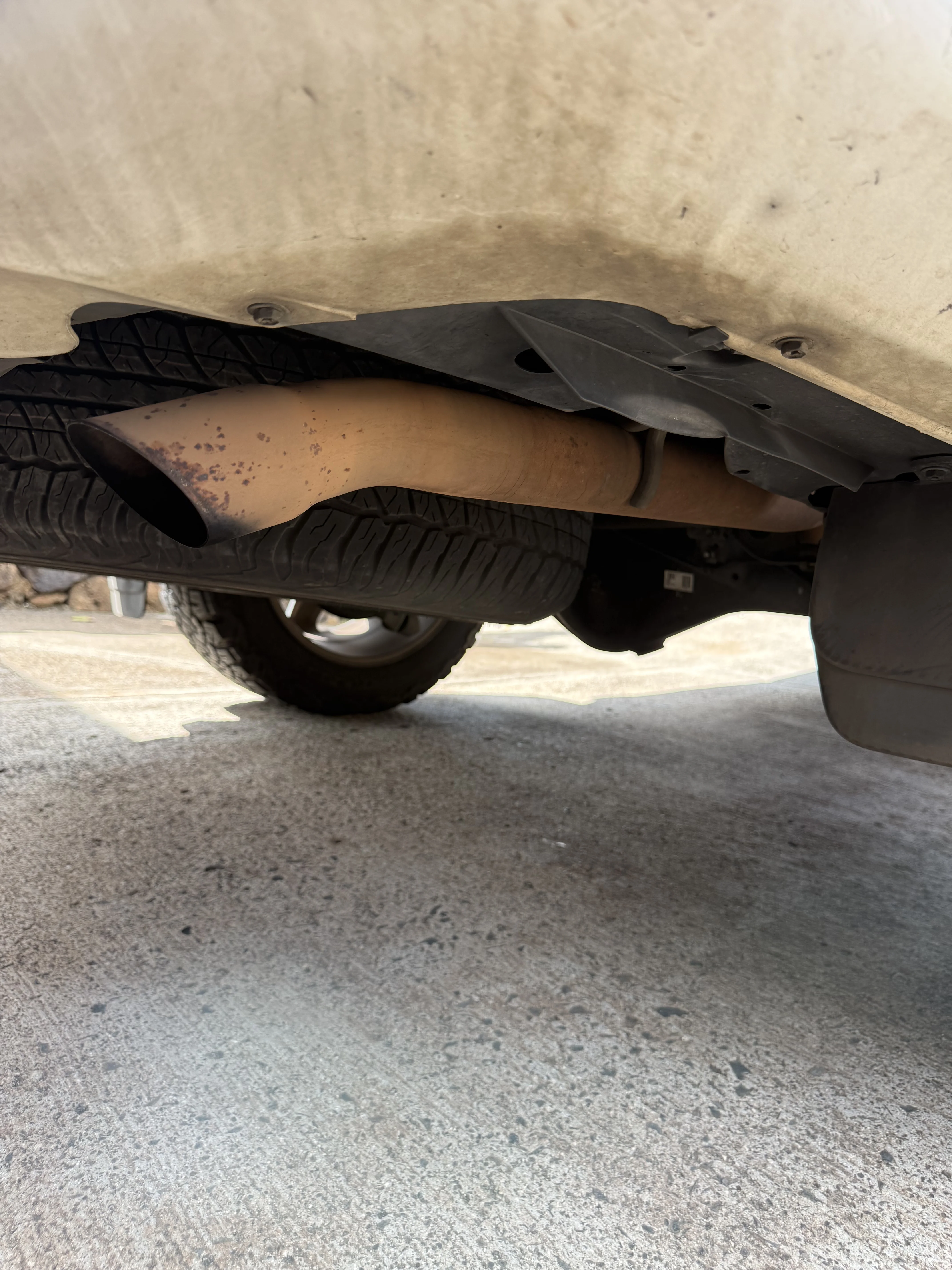 Corroded, rust-stained exhaust tip on a Toyota 4Runner before Chopped Details detailing